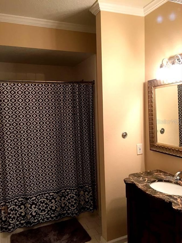 bathroom with vanity and crown molding