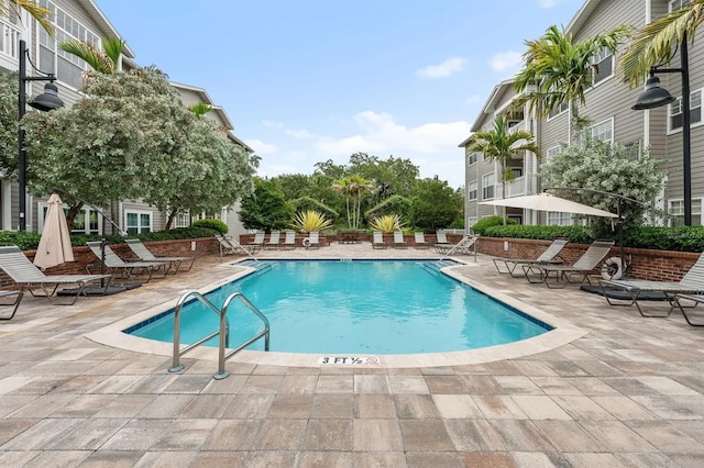 view of swimming pool featuring a patio