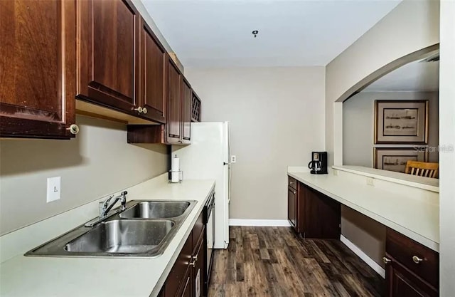 kitchen featuring dark hardwood / wood-style flooring, sink, dark brown cabinetry, and black dishwasher