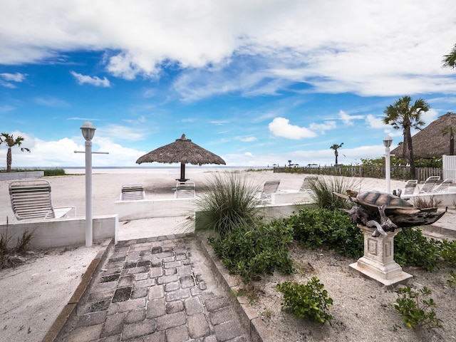 view of patio with a water view