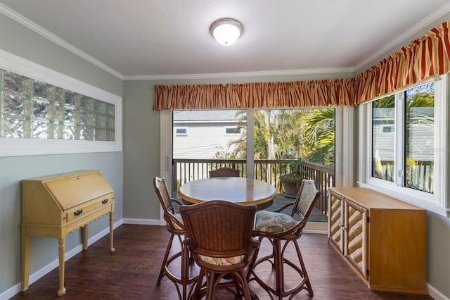 dining area featuring dark wood-type flooring and ornamental molding