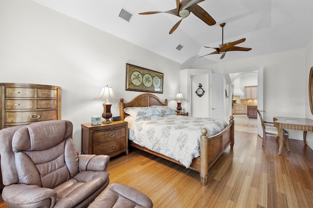 bedroom featuring lofted ceiling, light hardwood / wood-style flooring, and ceiling fan