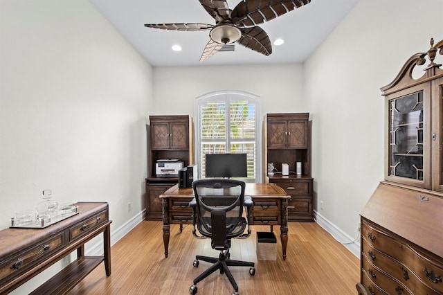 office with ceiling fan and light wood-type flooring