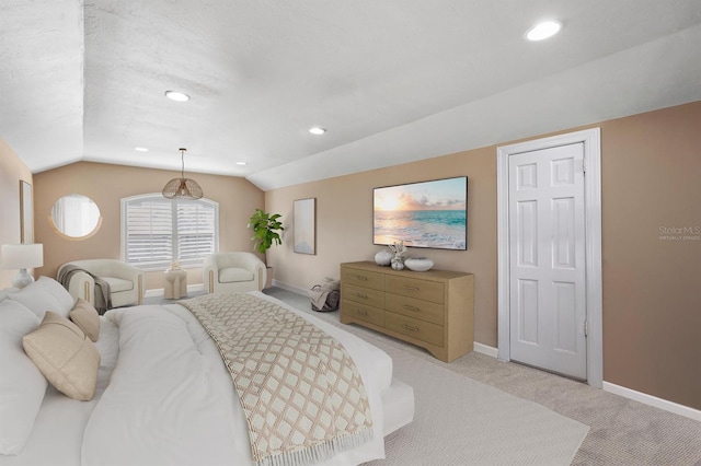 carpeted bedroom featuring lofted ceiling