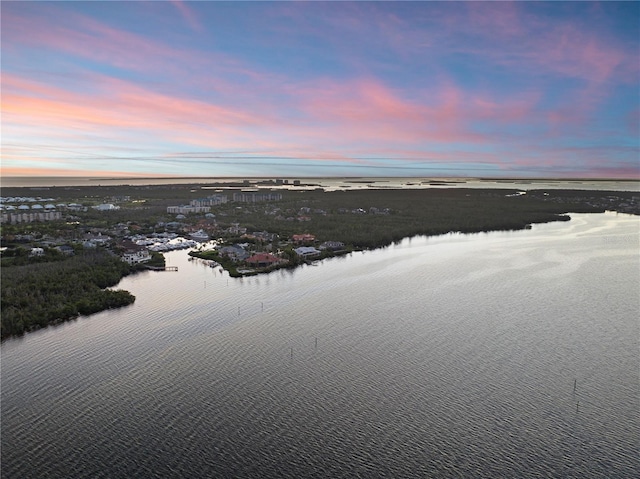 aerial view at dusk with a water view