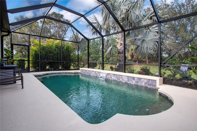 view of swimming pool with pool water feature, a lanai, and a patio area