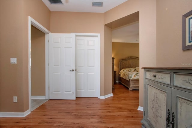 corridor featuring light hardwood / wood-style floors