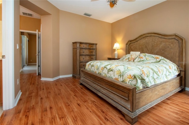 bedroom with hardwood / wood-style floors and ceiling fan