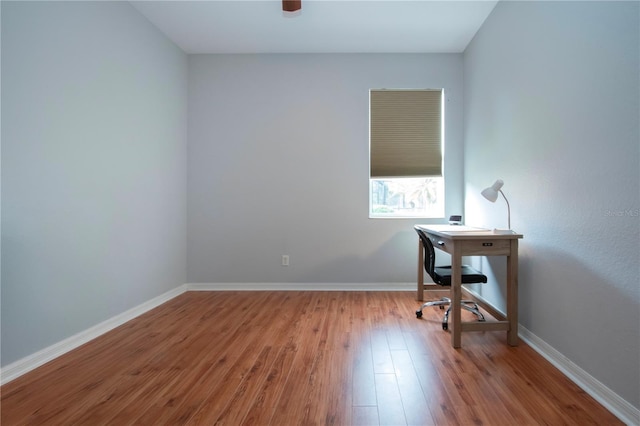 office space with ceiling fan and light hardwood / wood-style flooring