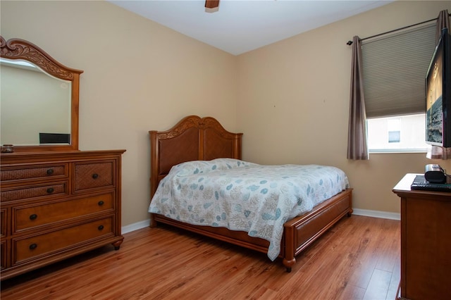 bedroom featuring light wood-type flooring and ceiling fan