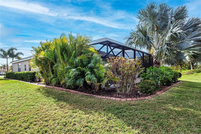 view of yard with a lanai