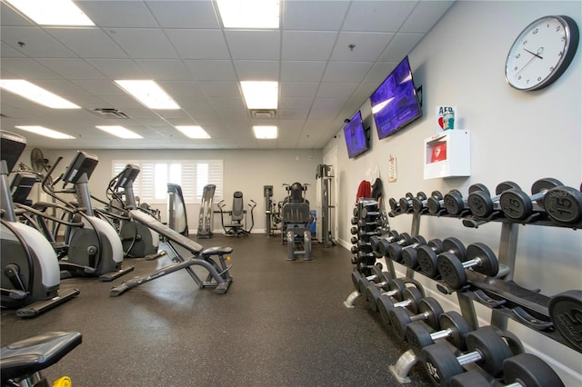 exercise room featuring a paneled ceiling