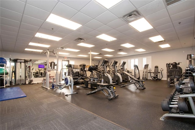 exercise room featuring a paneled ceiling