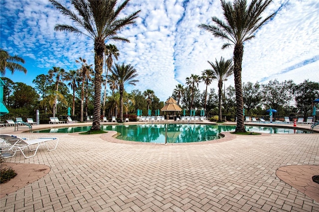 view of swimming pool featuring a gazebo and a patio