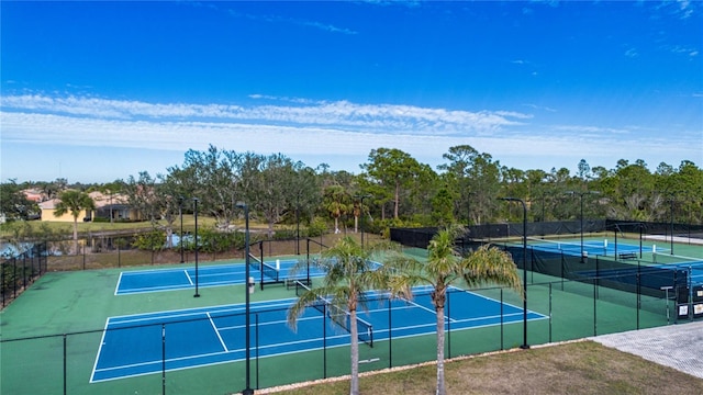 view of sport court featuring a water view