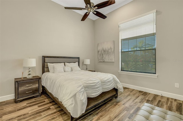 bedroom featuring hardwood / wood-style floors and ceiling fan