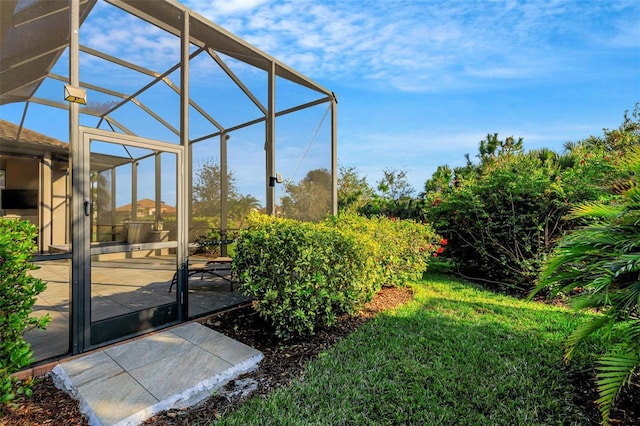 view of yard featuring a lanai