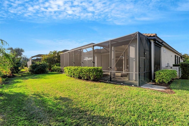 view of yard with glass enclosure