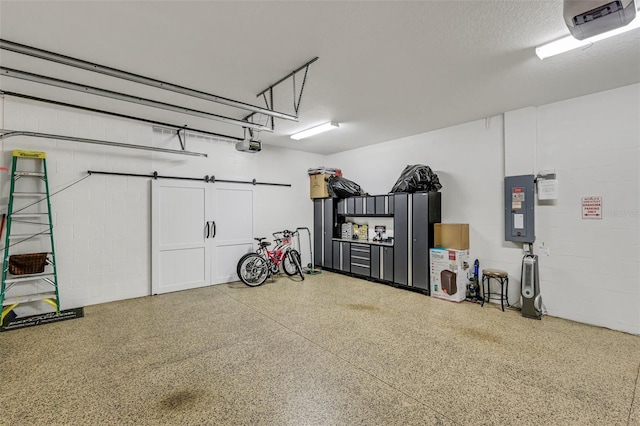 garage with a garage door opener and electric panel