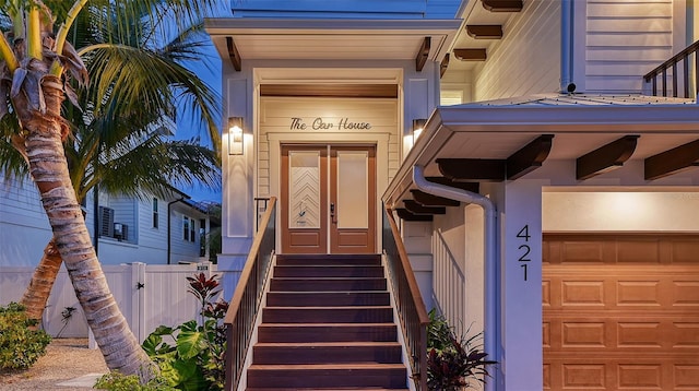 view of exterior entry with a garage