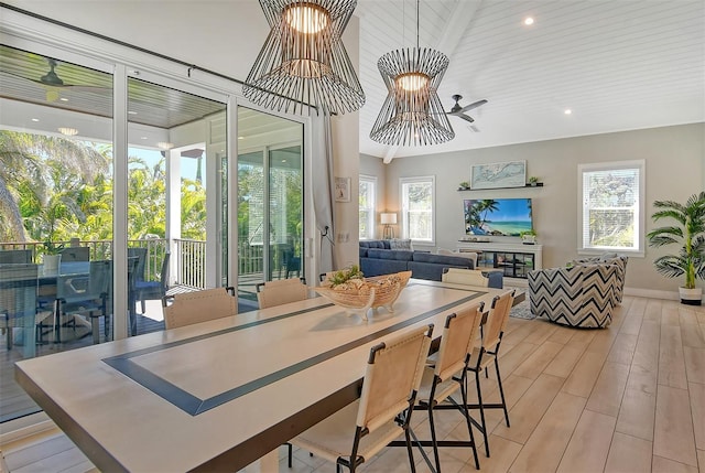 dining space with light hardwood / wood-style floors and wooden ceiling