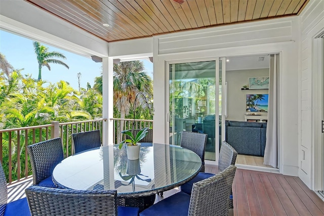 sunroom featuring wood ceiling