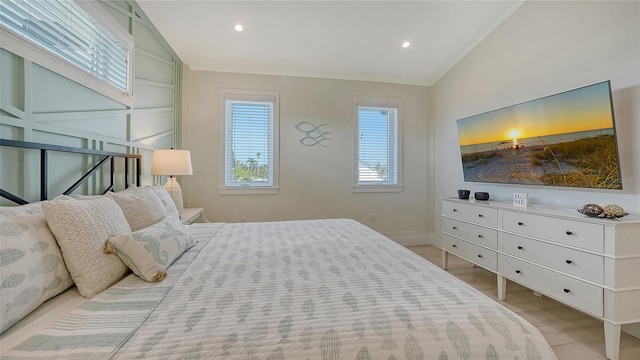 bedroom featuring light hardwood / wood-style flooring and vaulted ceiling