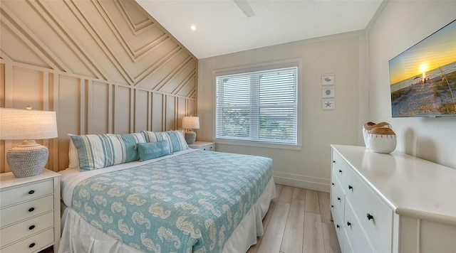 bedroom featuring ceiling fan and light hardwood / wood-style flooring