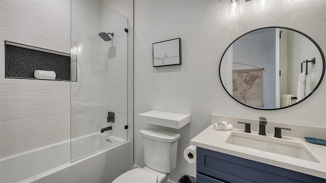 full bathroom with vanity, toilet, and tiled shower / bath