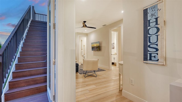 staircase featuring wood-type flooring