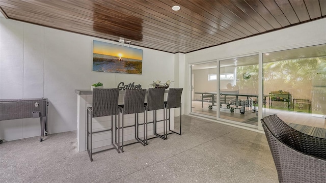 dining space with wooden ceiling