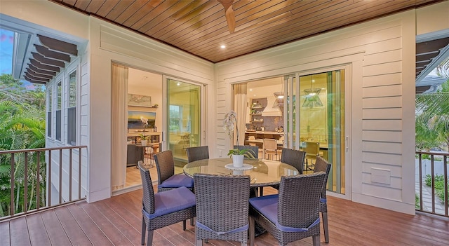 dining room with a wealth of natural light, wood-type flooring, and wooden ceiling