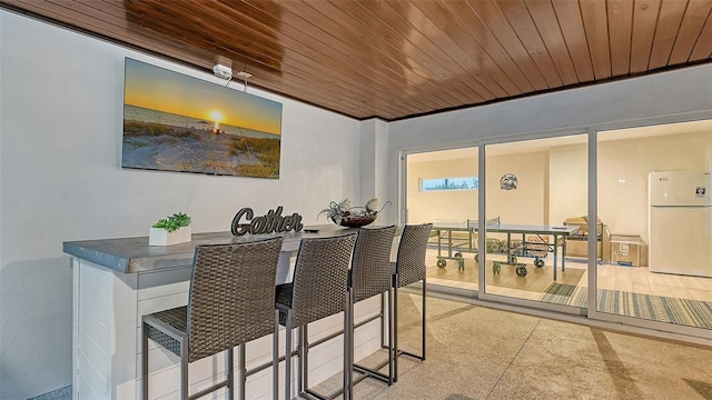 dining room with wood ceiling