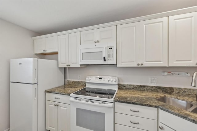 kitchen featuring white appliances, sink, and white cabinets