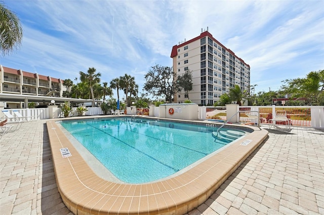 view of swimming pool featuring a patio area