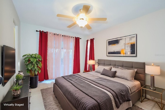 bedroom featuring ceiling fan and light tile patterned flooring