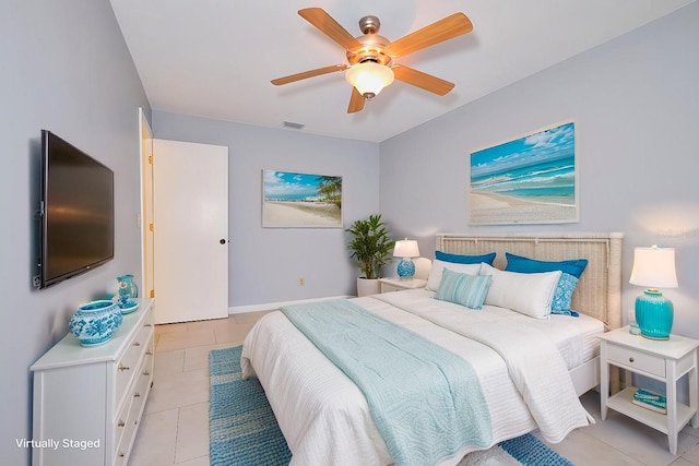 bedroom with ceiling fan and light tile patterned floors