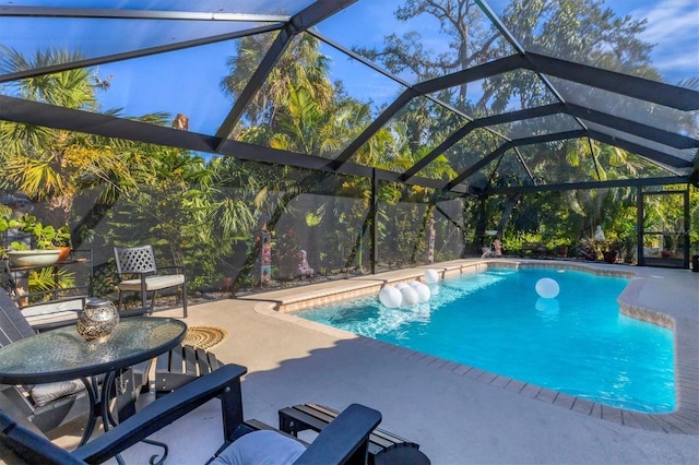 pool with a patio area and a lanai