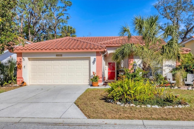 view of front of home featuring a garage, a tiled roof, and stucco siding