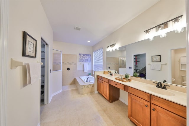 full bathroom with vanity, tile patterned floors, independent shower and bath, and toilet