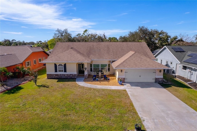 ranch-style home with a garage and a front yard