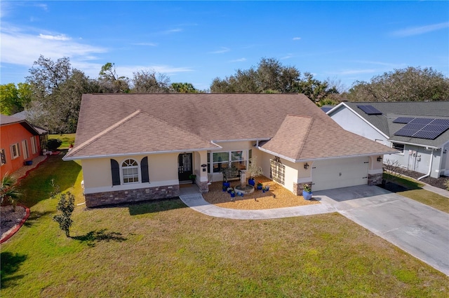 ranch-style home featuring a garage and a front lawn