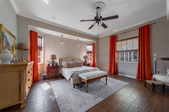 bedroom featuring ornamental molding, ceiling fan, and dark hardwood / wood-style flooring