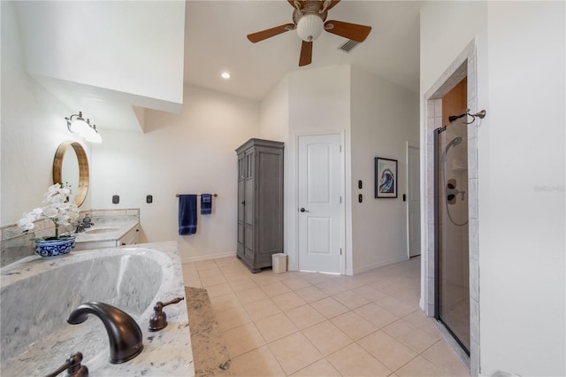 bathroom with tile patterned flooring, vanity, separate shower and tub, and vaulted ceiling