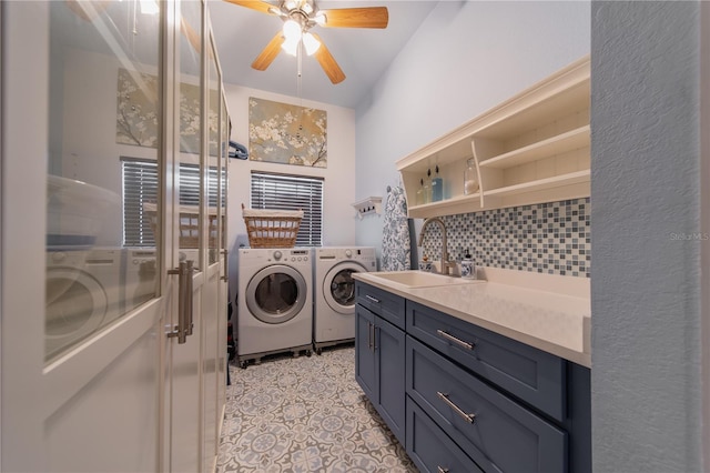 laundry area with ceiling fan, washer and clothes dryer, sink, and light tile patterned floors