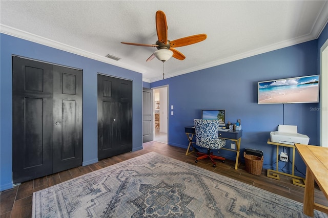 office space featuring crown molding, ceiling fan, and dark hardwood / wood-style floors