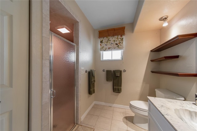 bathroom featuring vanity, tile patterned floors, toilet, and walk in shower