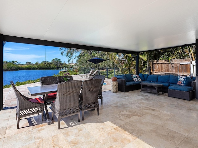 view of patio featuring outdoor lounge area and a water view