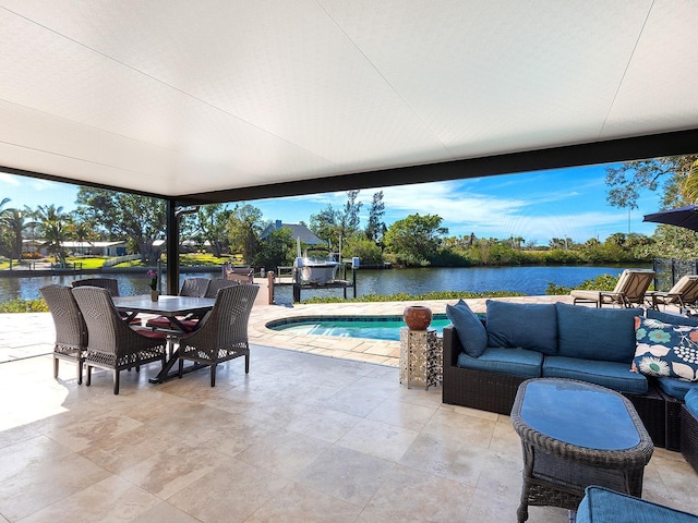 view of patio / terrace with a water view and outdoor lounge area