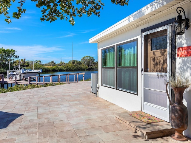 view of patio featuring a water view